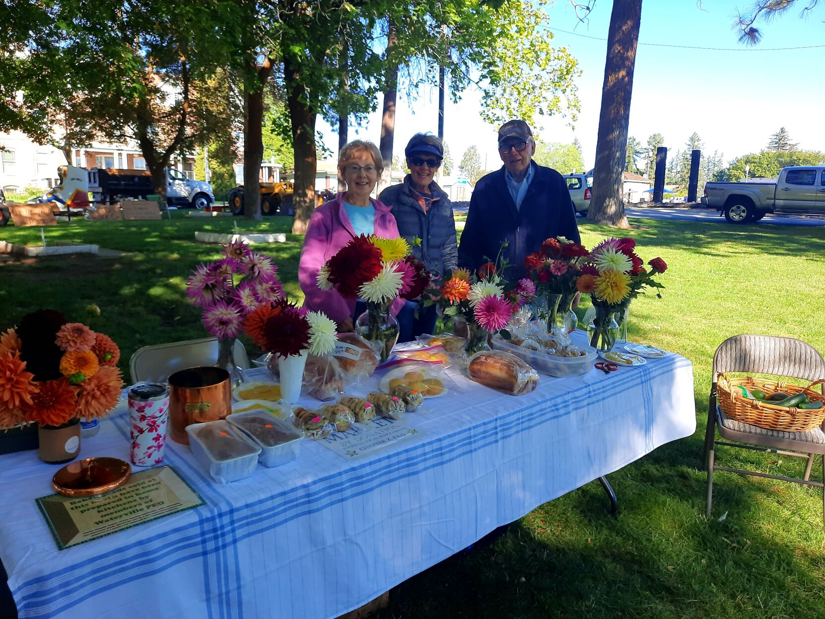 Members of the Waterville PEO show their baked goods and flowers..jpg